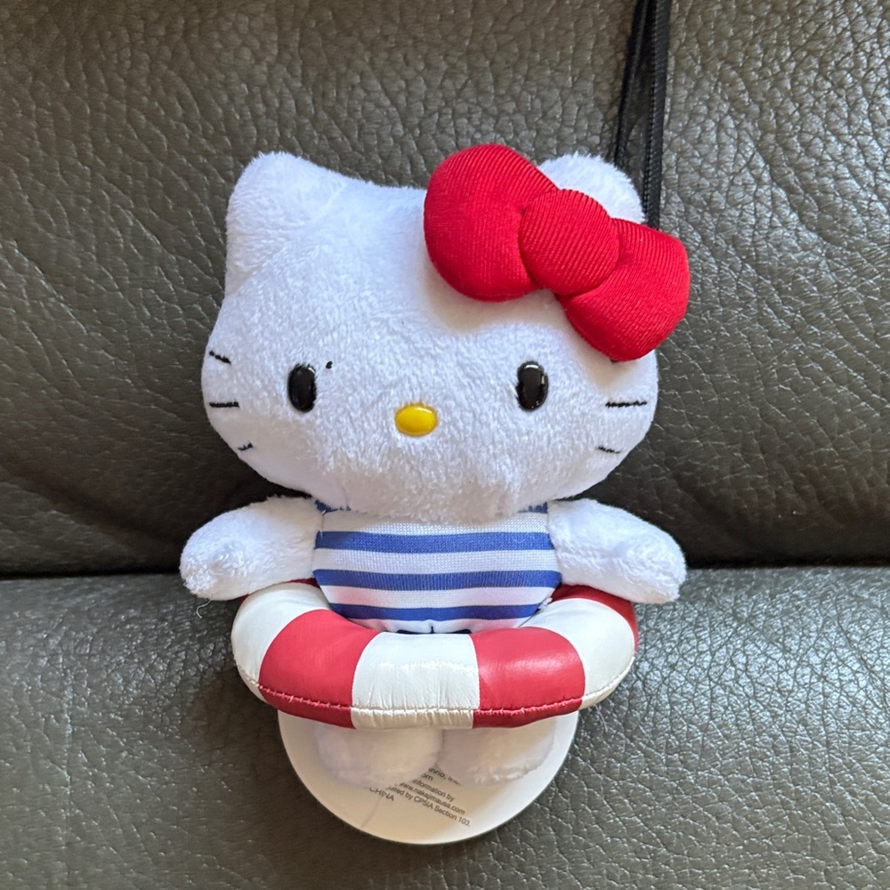 Hello kitty bathing suit with tube stuffed animal